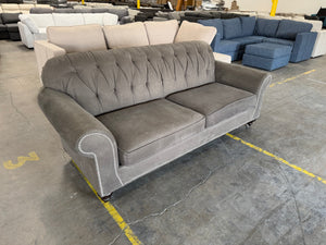 Gray Tufted Sofa with Nailhead Trim