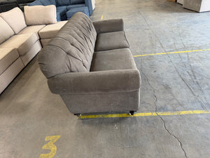 Gray Tufted Sofa with Nailhead Trim
