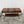 Vintage World Map Trunk-Style Console Table with Iron Scroll Legs