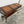 Vintage World Map Trunk-Style Console Table with Iron Scroll Legs
