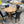 Round Oak Pedestal Dining Table with Leaf & 4 Black Faux Leather Chairs