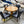 Round Oak Pedestal Dining Table with Leaf & 4 Black Faux Leather Chairs