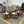 9-Pc Glass Dining Table & Maple Wood Chair Set